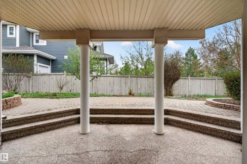 Covered patio featuring two support columns and a textured ceiling - 201 Erin Ridge Drive, St. Albert, AB - Outdoor With Deck Patio Veranda With Exterior