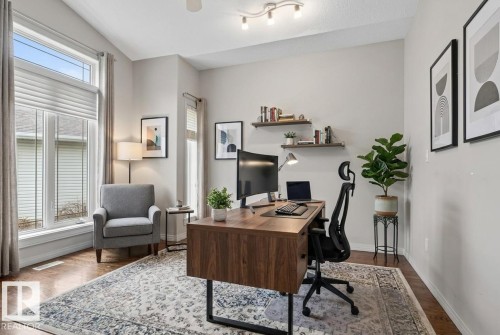 Versatile room featuring wood-finish flooring, an angled vaulted ceiling, and recessed lighting - 201 Erin Ridge Drive, St. Albert, AB - Indoor Photo Showing Office