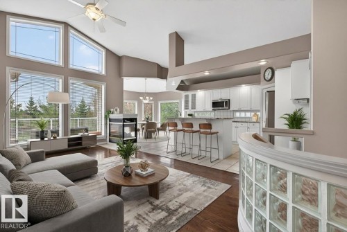 Spacious living area featuring a vaulted ceiling and an array of large windows - 201 Erin Ridge Drive, St. Albert, AB - Indoor Photo Showing Living Room