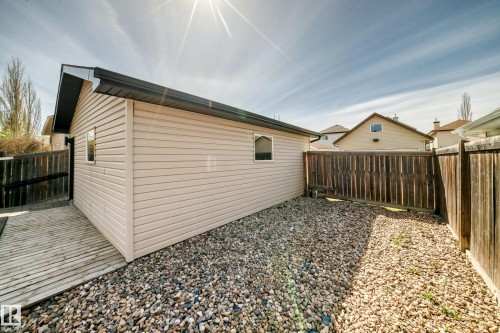 Detached auxiliary building with horizontal siding, dark fascia, and dark gutters - 5333 Terwillegar Boulevard, Edmonton, AB - Outdoor With Exterior