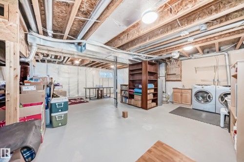 Unfinished basement featuring exposed wood joists and utility piping - 5333 Terwillegar Boulevard, Edmonton, AB - Indoor