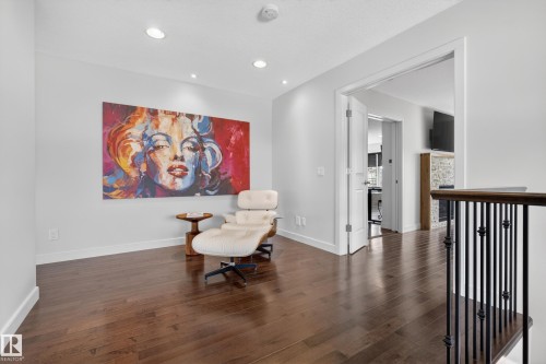 Bright room featuring rich wood-finish flooring, recessed lighting, and white baseboards - 2760 Watcher Way, Edmonton, AB - Indoor Photo Showing Other Room