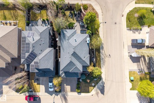 Aerial perspective highlighting a multi-level roofline with solar panel installations - 2760 Watcher Way, Edmonton, AB - Outdoor
