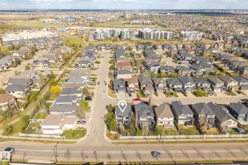 Aerial perspective showcasing a residential development with varied housing styles and mature landscaping - 2760 Watcher Way, Edmonton, AB - Outdoor With View