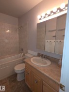 Bathroom vanity with an integrated sink and laminate countertop - 