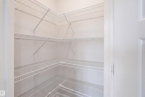 White wire shelving system providing extensive storage - 2284 Chokecherry Close, Edmonton, AB - Indoor With Storage