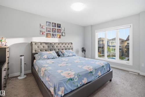 Bedroom featuring light gray walls and plush gray carpeting - 2284 Chokecherry Close, Edmonton, AB - Indoor Photo Showing Bedroom