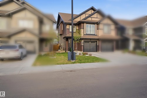 Image quality insufficient for description - 2284 Chokecherry Close, Edmonton, AB - Outdoor With Facade