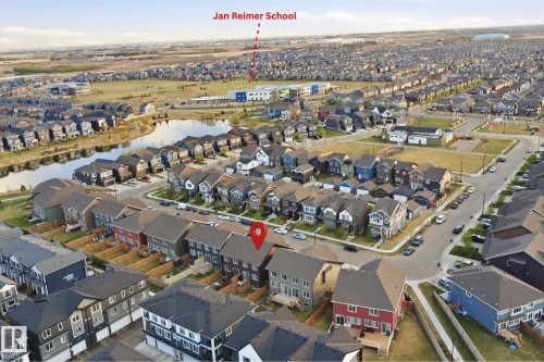 Aerial perspective showcasing a residential neighborhood with diverse housing styles - 2284 Chokecherry Close, Edmonton, AB - Outdoor With View