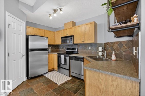 50 150 Edwards Drive, Edmonton, AB - Indoor Photo Showing Kitchen With Stainless Steel Kitchen With Double Sink