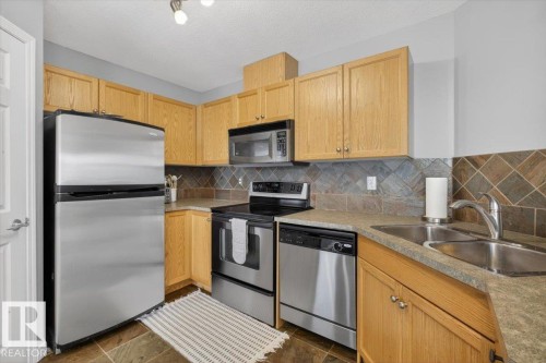 50 150 Edwards Drive, Edmonton, AB - Indoor Photo Showing Kitchen With Stainless Steel Kitchen With Double Sink