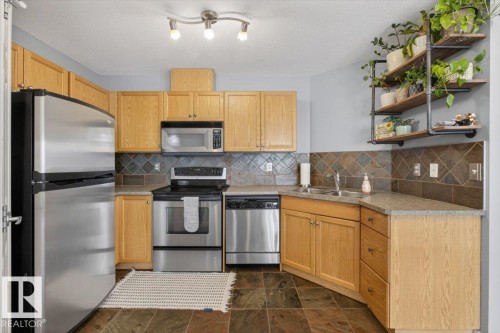 50 150 Edwards Drive, Edmonton, AB - Indoor Photo Showing Kitchen With Stainless Steel Kitchen With Double Sink