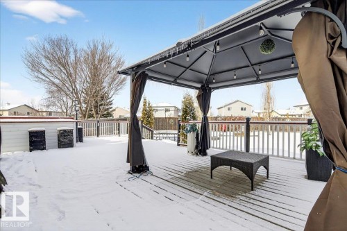 The property features an outdoor deck with a gazebo structure, complete with string lights - 3518 18 Street, Edmonton, AB - Outdoor With Deck Patio Veranda