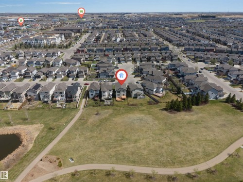The property features a two-story residence with a light-colored exterior and a dark roof - 2138 32B Street, Edmonton, AB - Outdoor With View