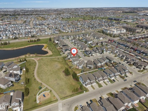 Aerial perspective showcasing a residential area with varied housing types - 2138 32B Street, Edmonton, AB - 
