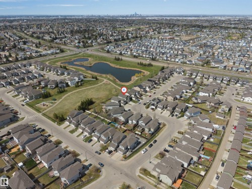 Aerial overview showcasing a residential neighborhood with varied housing styles - 2138 32B Street, Edmonton, AB - 