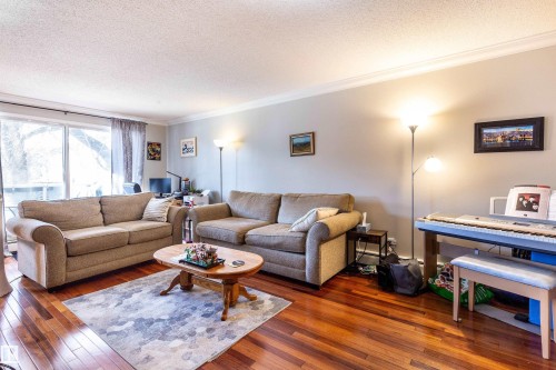 201 10720 84 Avenue, Edmonton, AB - Indoor Photo Showing Living Room