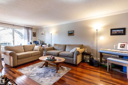 201 10720 84 Avenue, Edmonton, AB - Indoor Photo Showing Living Room