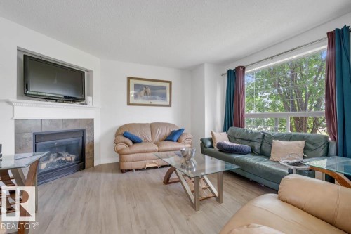57 Suntree Promenade, Leduc, AB - Indoor Photo Showing Living Room With Fireplace