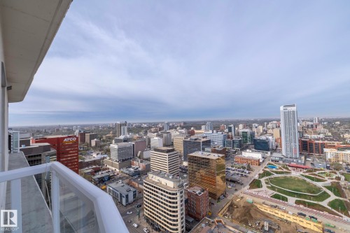 Expansive city panorama from a high-rise balcony featuring a glass and white railing - 3104 10152 104 Street, Edmonton, AB - Outdoor With View