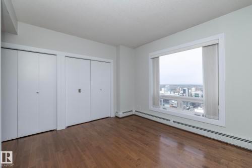 Expansive window framing cityscape - 3104 10152 104 Street, Edmonton, AB - Indoor Photo Showing Other Room
