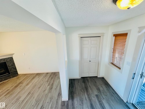 4811 152 Avenue, Edmonton, AB - Indoor Photo Showing Other Room With Fireplace
