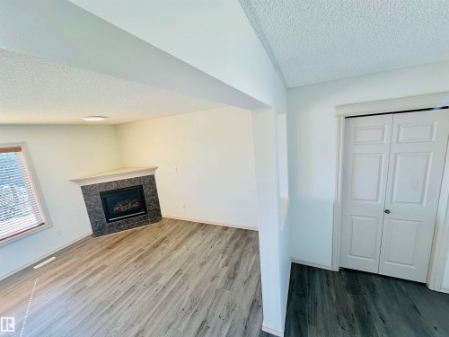 4811 152 Avenue, Edmonton, AB - Indoor Photo Showing Living Room With Fireplace