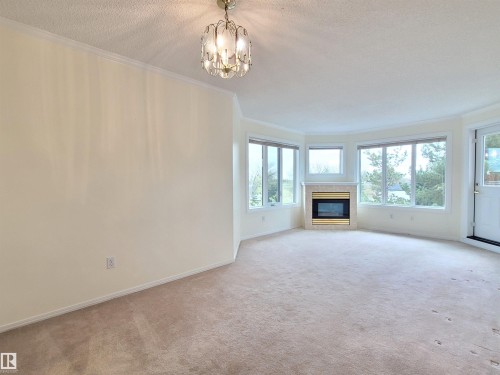 408 10610 76 Street, Edmonton, AB - Indoor Photo Showing Living Room With Fireplace
