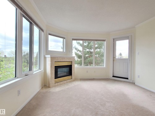 408 10610 76 Street, Edmonton, AB - Indoor Photo Showing Living Room With Fireplace