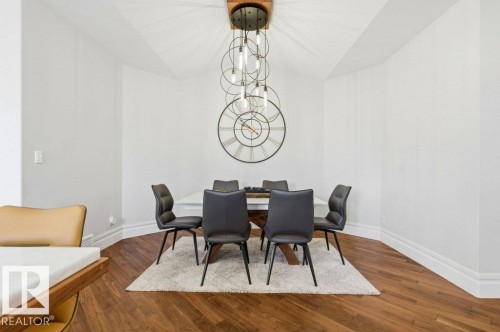 Dining space featuring hardwood flooring, white walls, and a recessed ceiling - 1 Sparrow Close, Fort Saskatchewan, AB - Indoor Photo Showing Dining Room