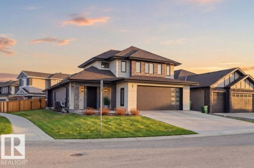 Contemporary two-story residence featuring a combination of siding and stone veneer - 1 Sparrow Close, Fort Saskatchewan, AB - Outdoor With Facade