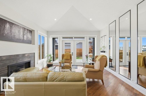 Vaulted ceilings with recessed lighting define this living space - 1 Sparrow Close, Fort Saskatchewan, AB - Indoor Photo Showing Living Room With Fireplace