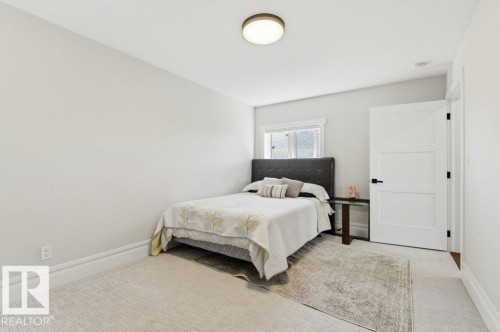 Neutral-toned interior room featuring light-colored walls and a textured ceiling - 1 Sparrow Close, Fort Saskatchewan, AB - Indoor Photo Showing Bedroom