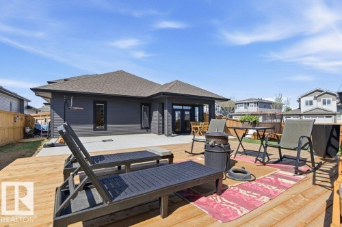 Expansive wood deck with a privacy fence - 1 Sparrow Close, Fort Saskatchewan, AB - Outdoor With Deck Patio Veranda With Exterior