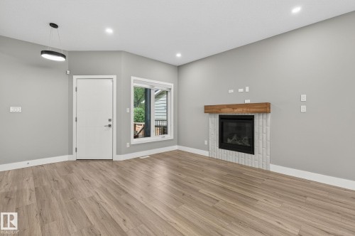 10906 54 Avenue, Edmonton, AB - Indoor Photo Showing Living Room With Fireplace