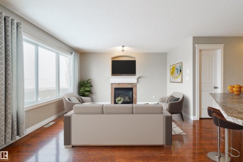 68 Meridian Loop, Stony Plain, AB - Indoor Photo Showing Living Room With Fireplace