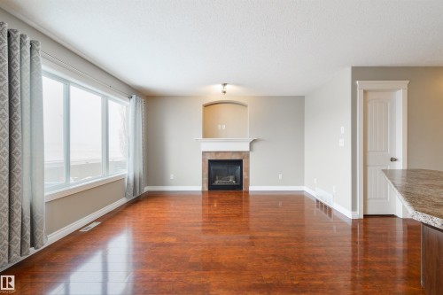 68 Meridian Loop, Stony Plain, AB - Indoor Photo Showing Living Room With Fireplace