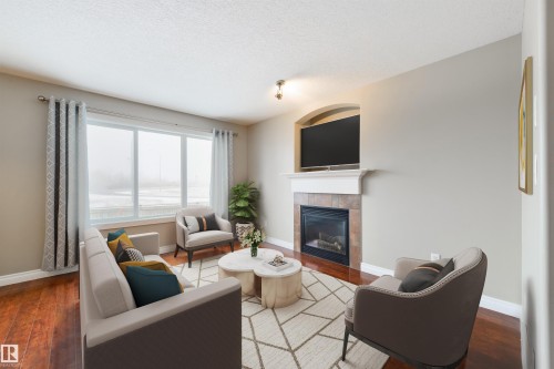 68 Meridian Loop, Stony Plain, AB - Indoor Photo Showing Living Room With Fireplace