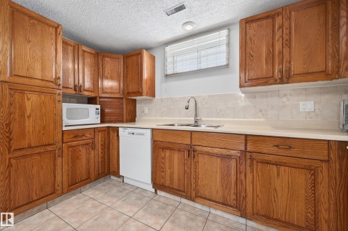 13916 61 Street Nw, Edmonton, AB - Indoor Photo Showing Kitchen With Double Sink