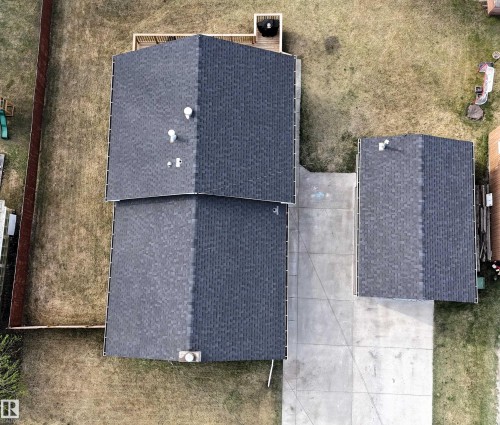 Asphalt shingle roofing on main structure and detached accessory building - 7126 4A Ave, Edson, AB - Outdoor