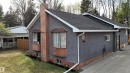 Stucco exterior with wood-finish trim and bay windows - 7126 4A Ave, Edson, AB  - Outdoor With Exterior 