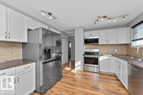 4303 104A Avenue, Edmonton, AB - Indoor Photo Showing Kitchen With Stainless Steel Kitchen With Double Sink