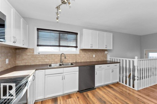4303 104A Avenue, Edmonton, AB - Indoor Photo Showing Kitchen With Double Sink