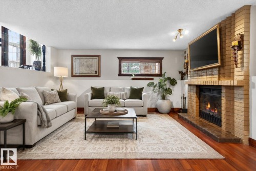 3332 44B Avenue, Edmonton, AB - Indoor Photo Showing Living Room With Fireplace