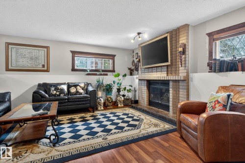 3332 44B Avenue, Edmonton, AB - Indoor Photo Showing Living Room With Fireplace