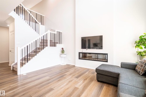 11979 34 Avenue, Edmonton, AB - Indoor Photo Showing Living Room With Fireplace