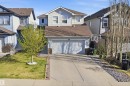 Siding exterior with stone accents and a two-car garage - 1453 Hays Way, Edmonton, AB  - Outdoor 
