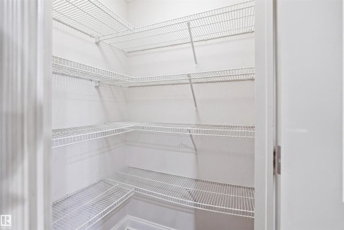 Integrated wire shelving system provides ample storage - 1144 35 Avenue, Edmonton, AB - Indoor With Storage