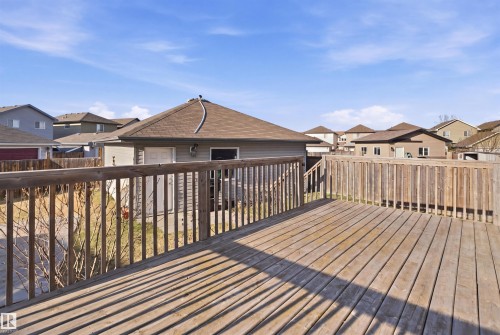 Raised wood deck featuring a full wooden railing and stairs - 1144 35 Avenue, Edmonton, AB - Outdoor With Deck Patio Veranda With Exterior