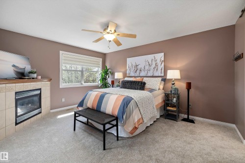 2311 Bailey Court, Edmonton, AB - Indoor Photo Showing Bedroom With Fireplace
